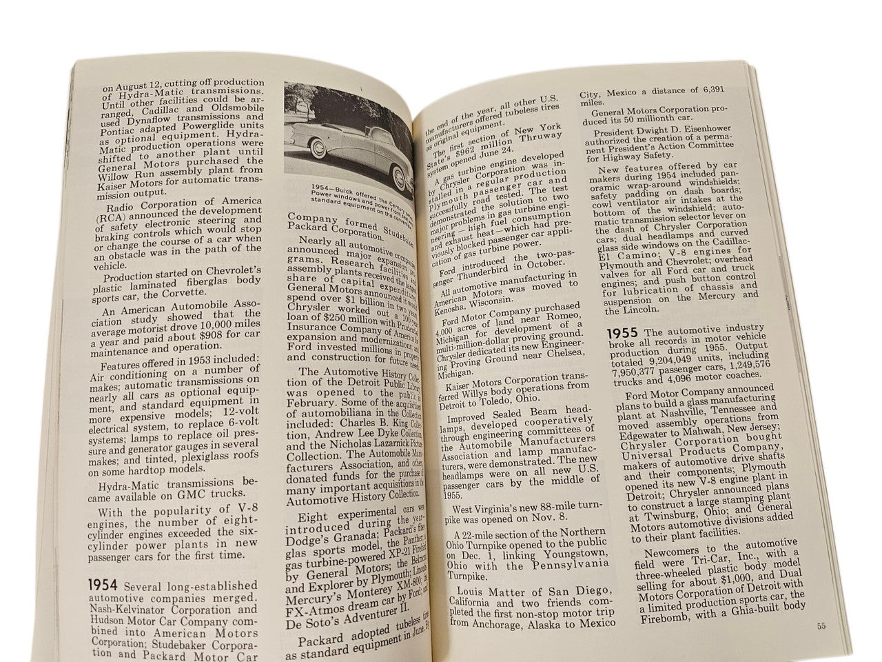 Vintage book open spread with dense paragraphs and page numbers in columns