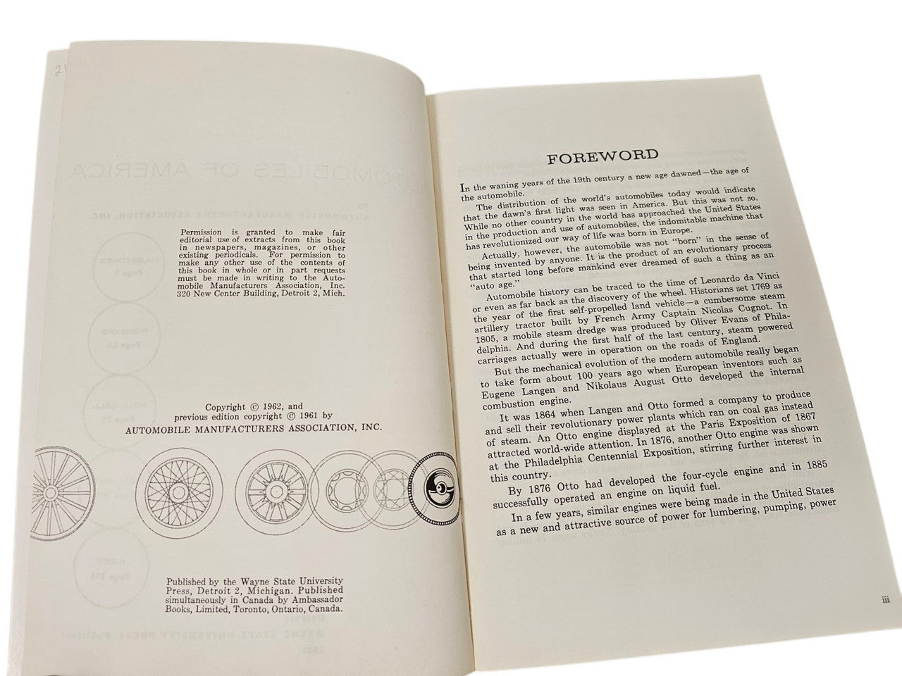 Vintage book open spread showing foreword text and small car line drawings