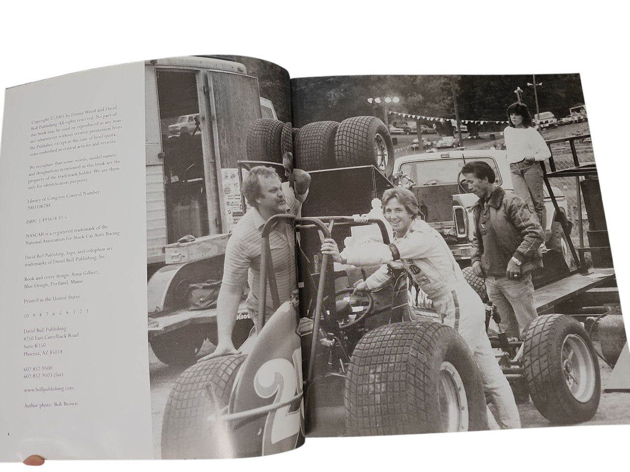 Open NASCAR Women book with vintage racing photo across two pages