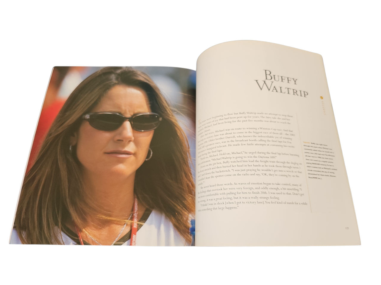 Open book with a woman portrait photo on the left and chapter text on the right