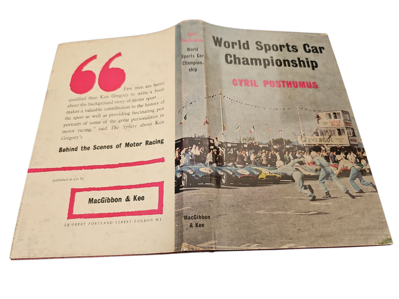 Open book with World Sports Car Championship title and racing photo spread