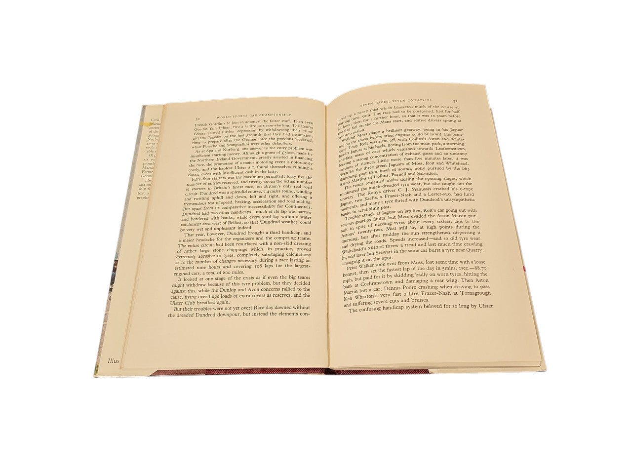 Open vintage book with two pages of dense printed text in cream.