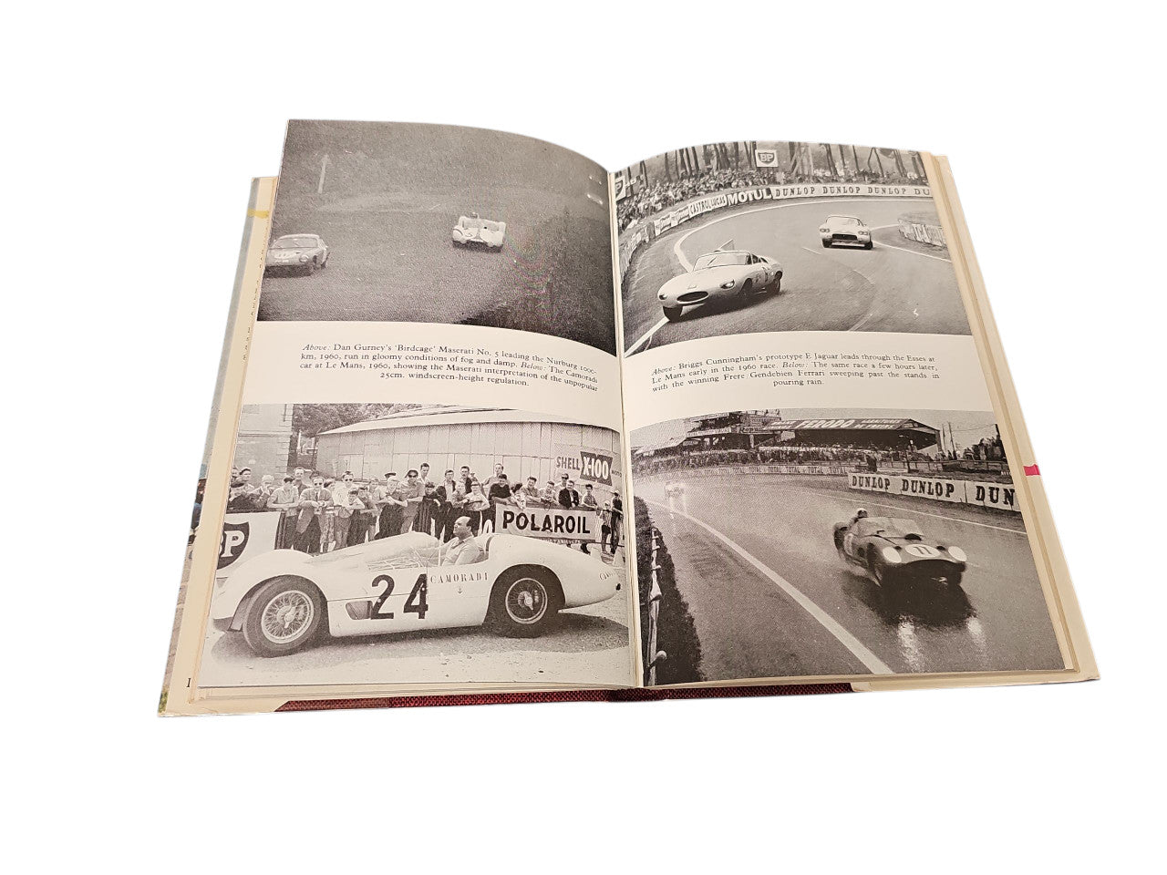 Open vintage book featuring black-and-white racing photos across both pages.