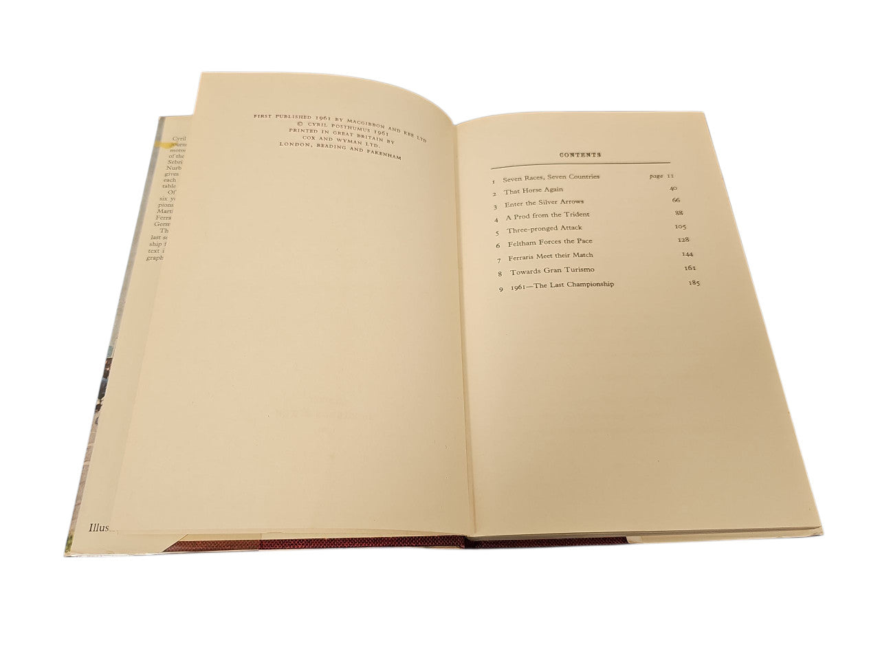 Open vintage book showing cream pages with printed text and a contents list on right.