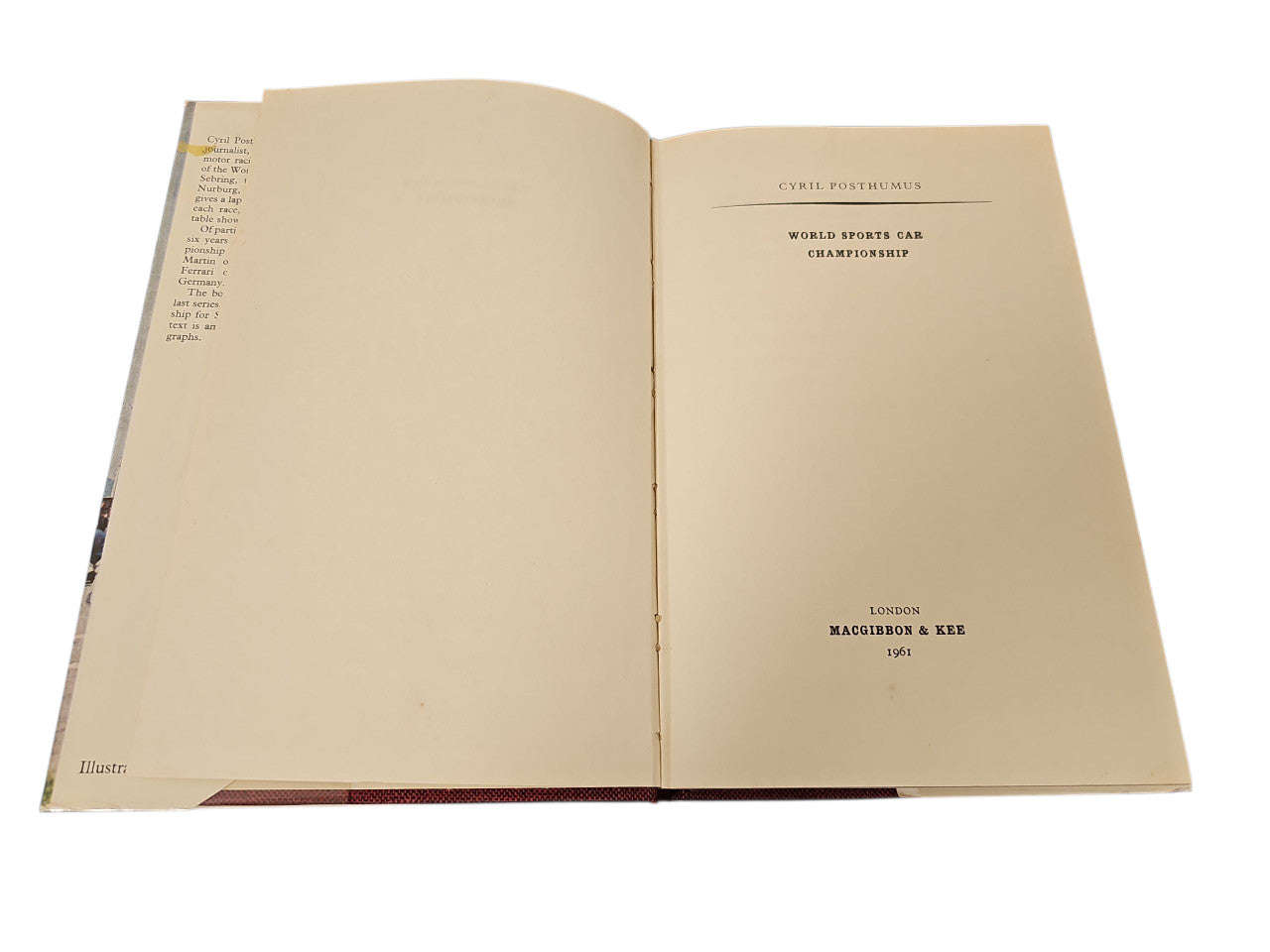Open vintage book with printed title text centered on the right page.