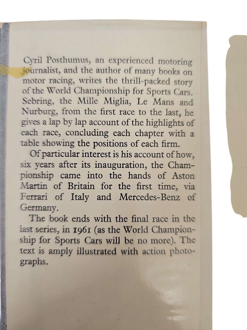 Book page with printed text about motor racing and championship history