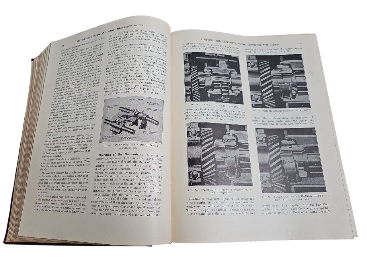 Open vintage manual book with technical diagrams and multi-panel illustrations