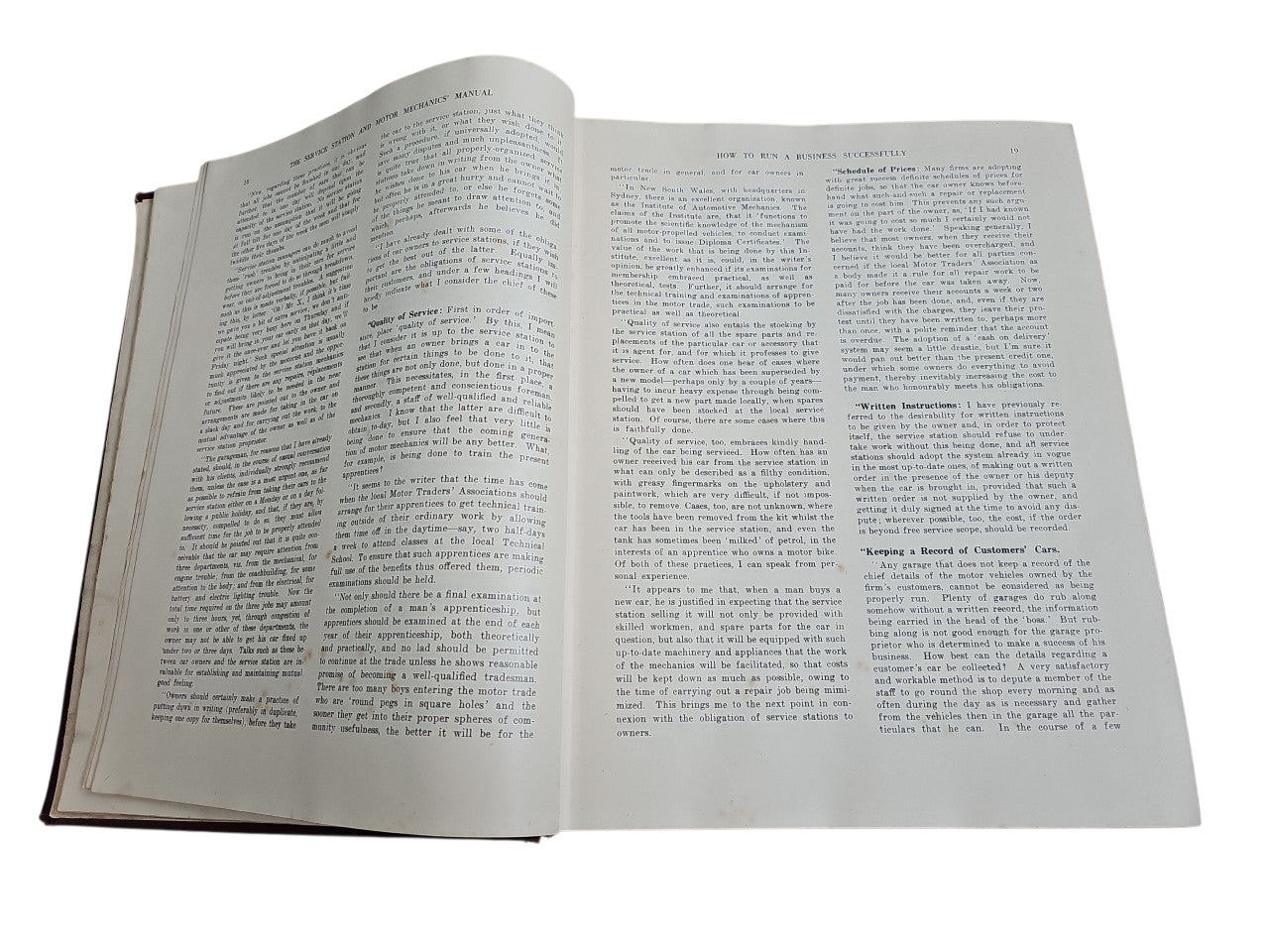 Open vintage manual book with two columns of printed text on both pages
