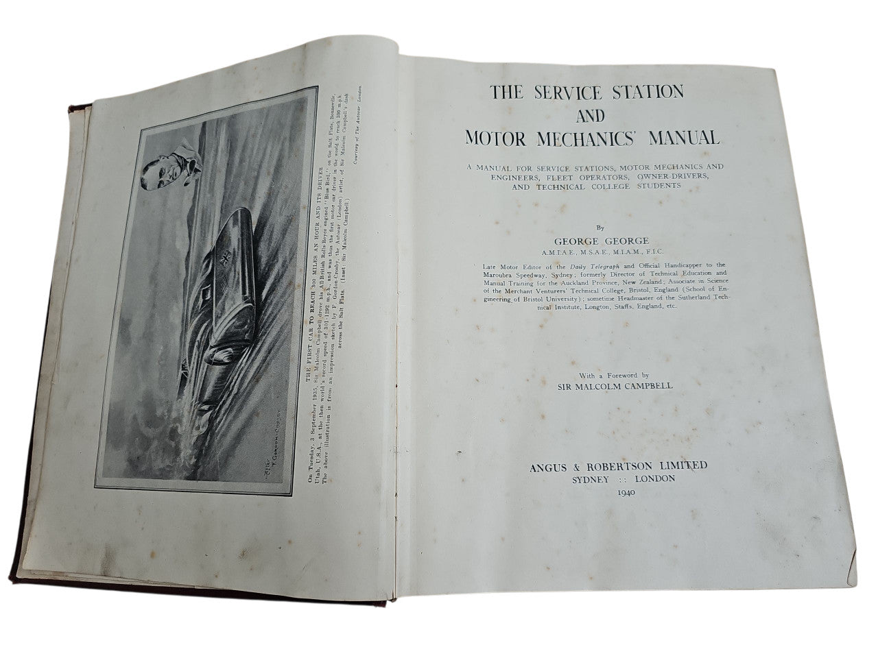 Open vintage manual book showing title page and black-and-white illustration