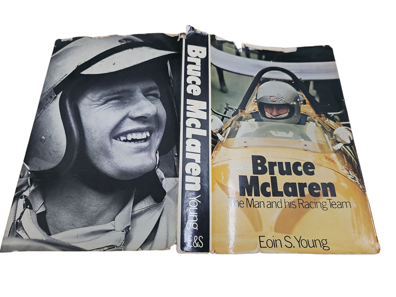 Book open to show spine and two cover panels: portrait and Bruce McLaren title