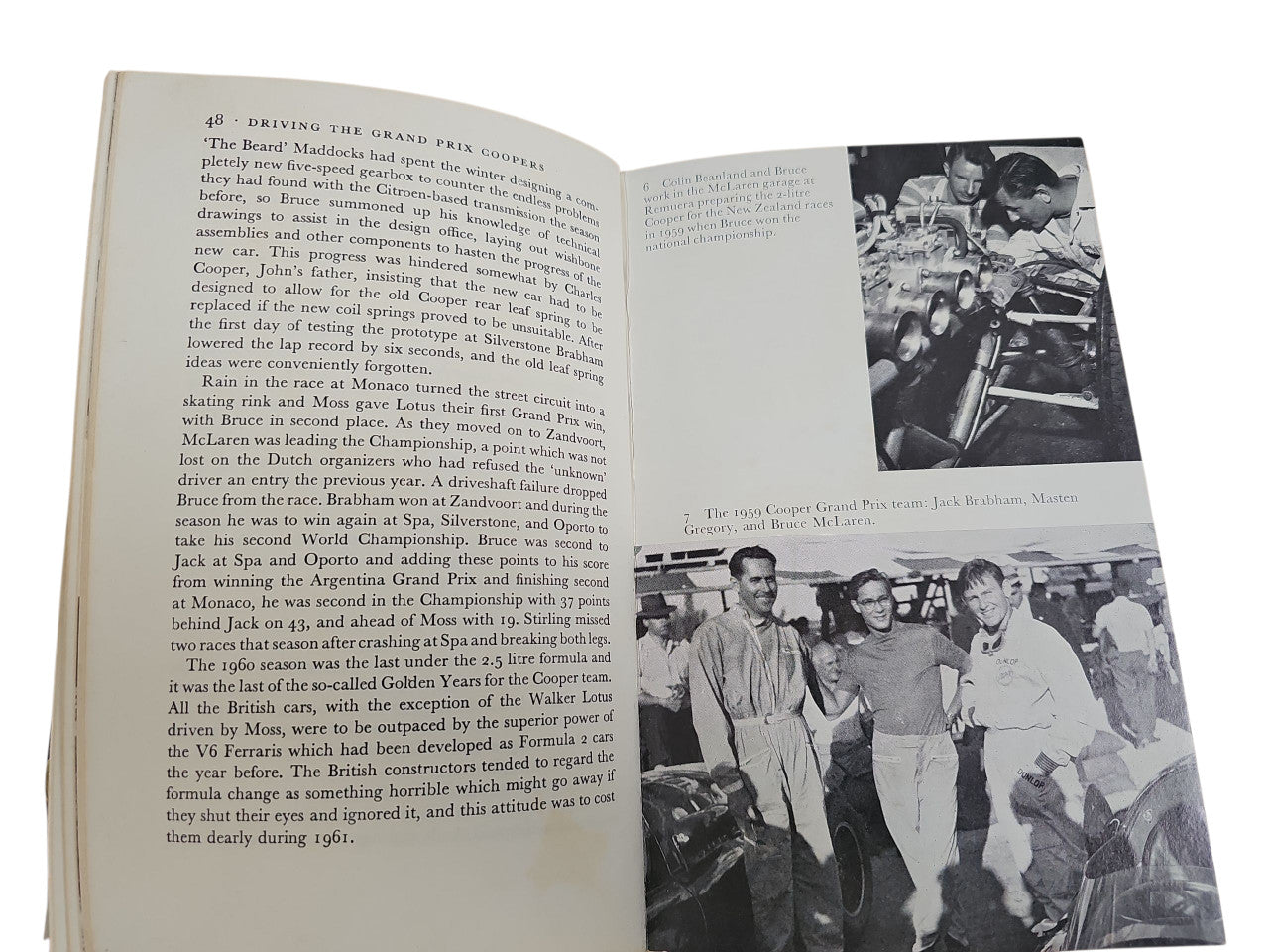 Book open showing printed text on left and photo pages on the right