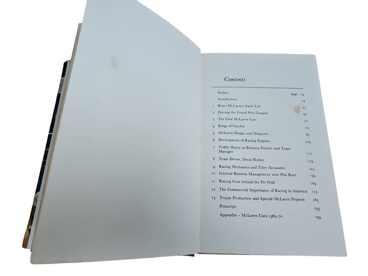 Book open to "Contents" page with a list of chapters and page numbers
