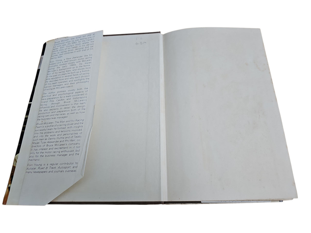 Book open showing left page with paragraphs and right page blank