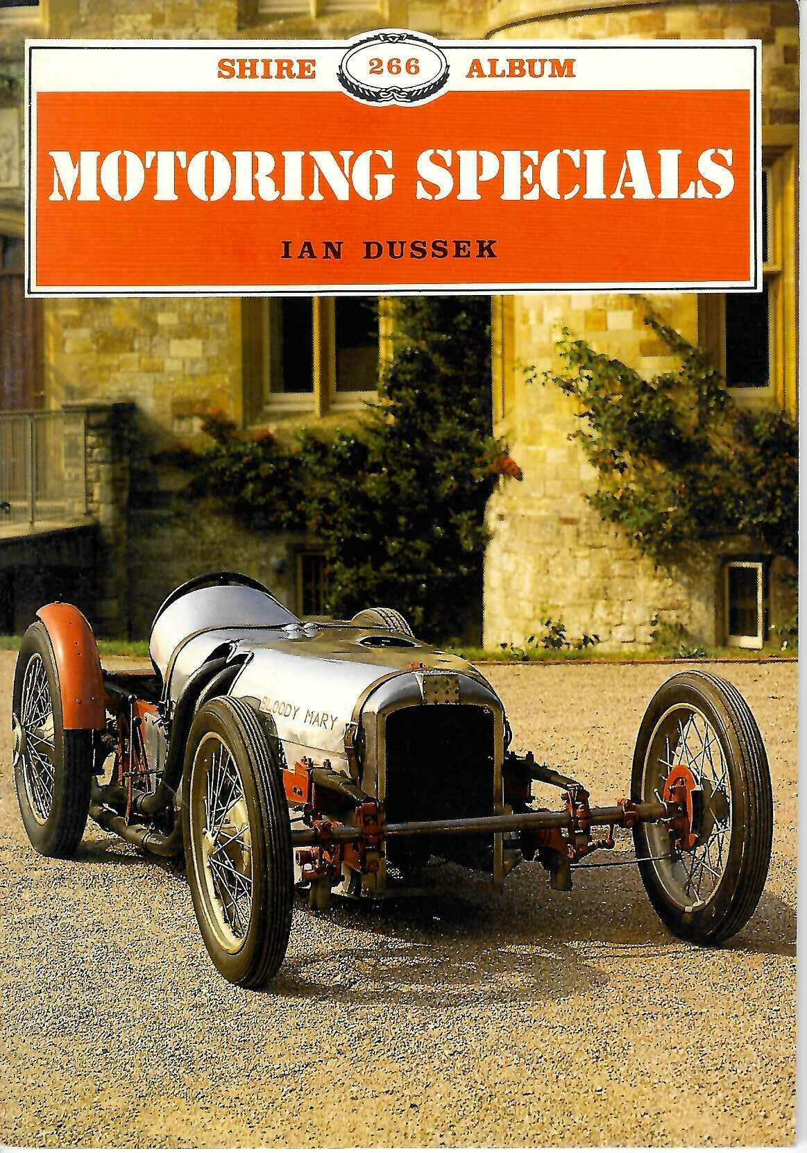 Motoring Specials book cover with orange title and classic race car illustration.