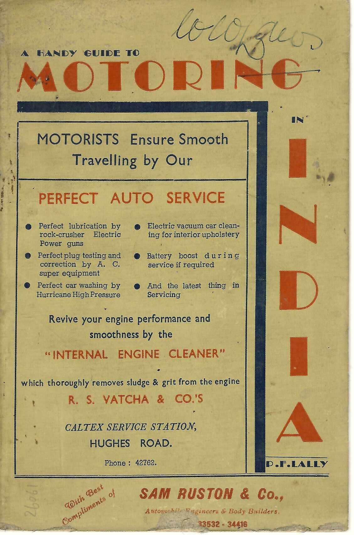 Vintage motoring guide book, front cover with large red “MOTORING” text