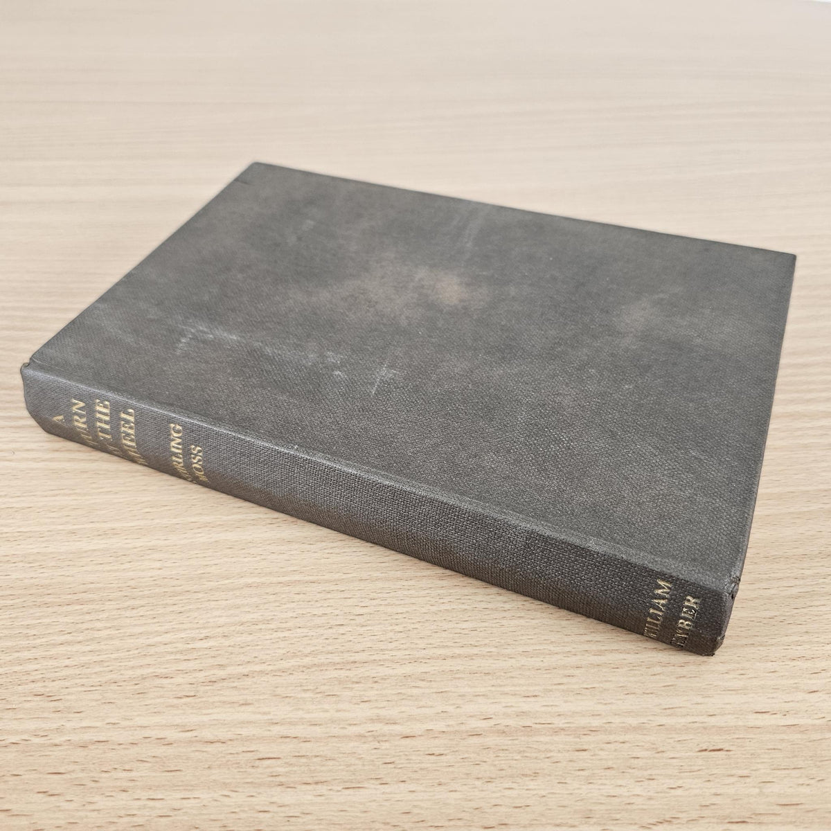 Vintage hardcover racing book with dark gray cloth cover and gold spine text