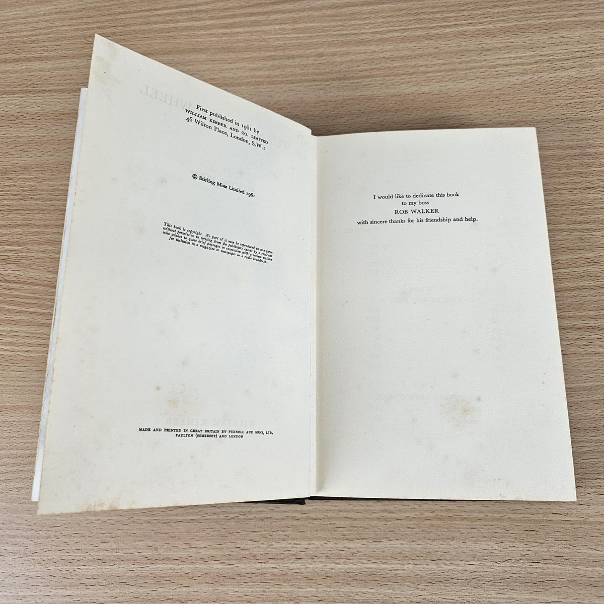 Open vintage book with cream pages showing printed text on both sides