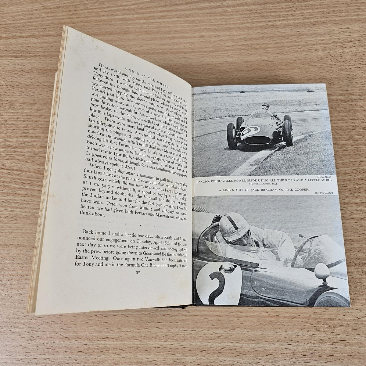 Open vintage racing book with text pages and black-and-white car photo spread