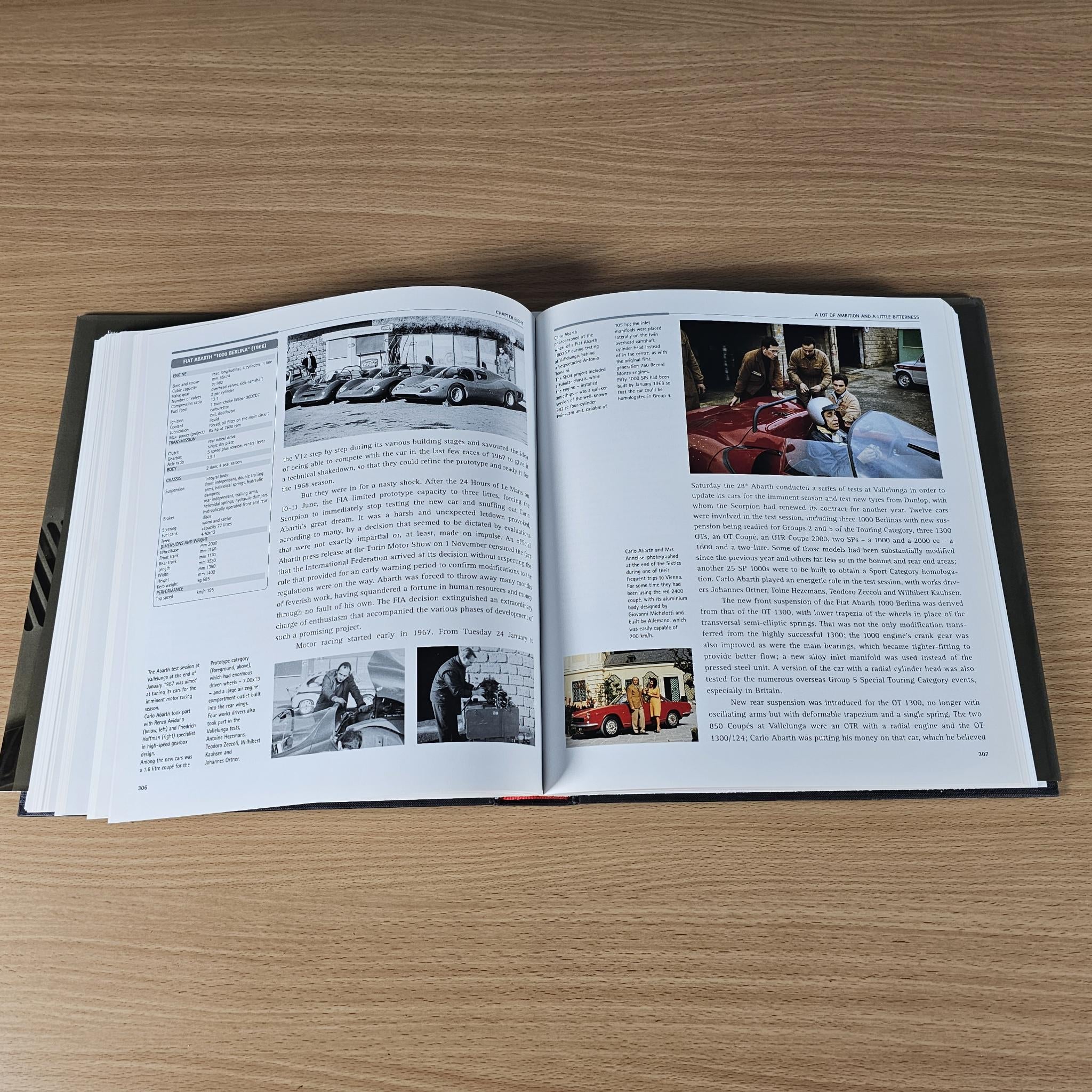 Open hardcover car book with a color car photo inset and surrounding text.
