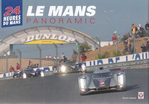 Panoramic race car photo with silver prototype on track under large arch