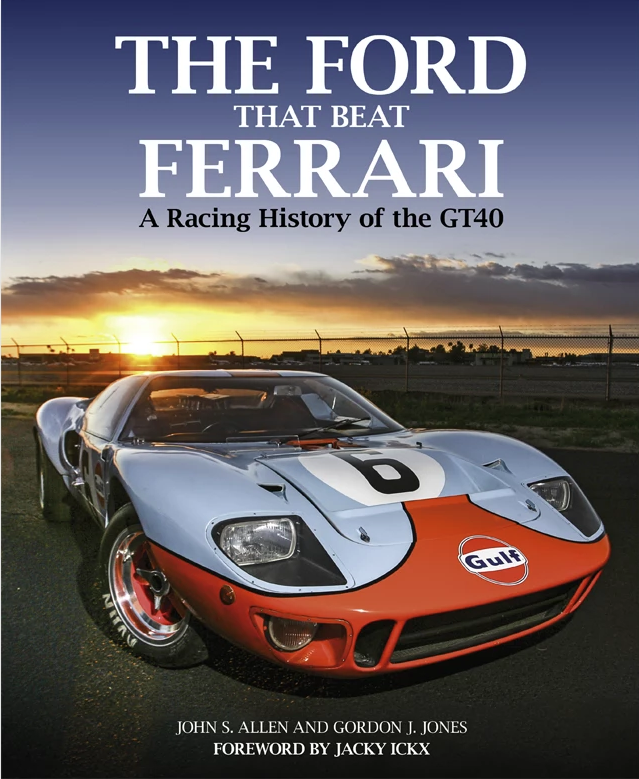 Racing history book with white and orange GT40-style race car on cover