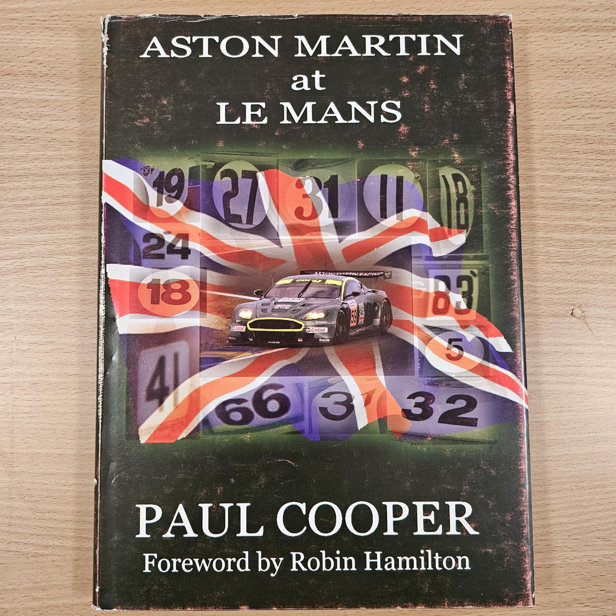 Hardcover book Aston Martin at Le Mans, Paul Cooper title and race car on cover