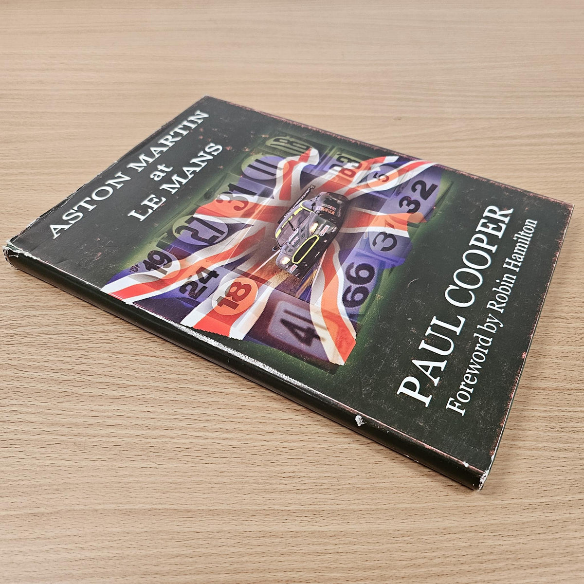 Hardcover book viewed from side, Paul Cooper title along spine and cover graphic