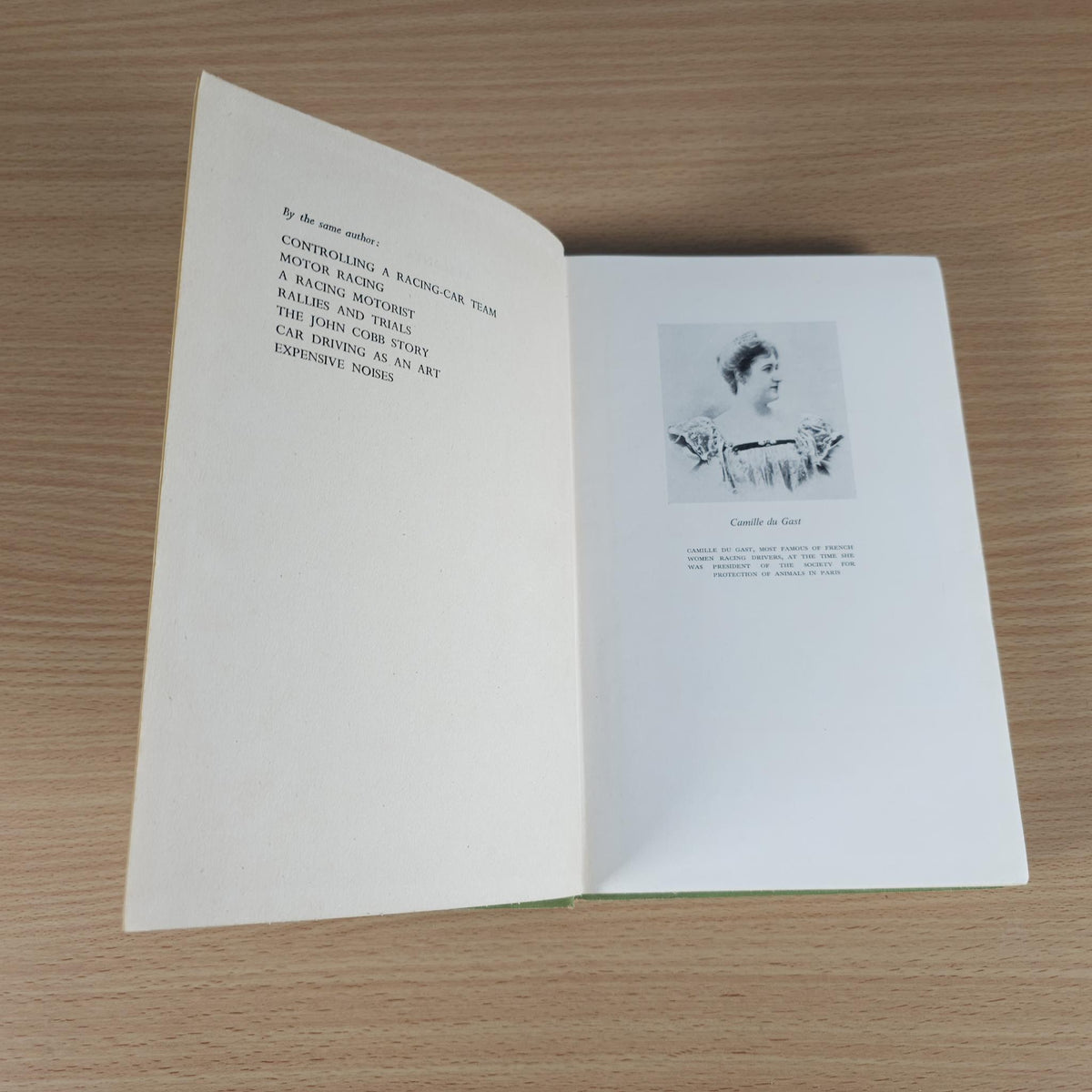 Open book with white pages and black text, photo near the right page.