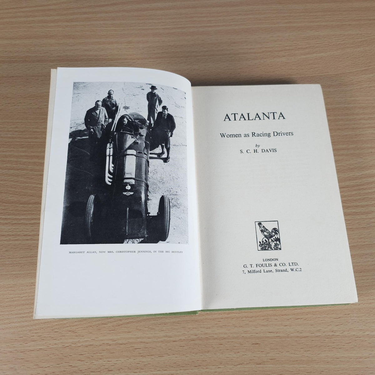 Open book spread with title ATALANTA and photo of race car drivers.