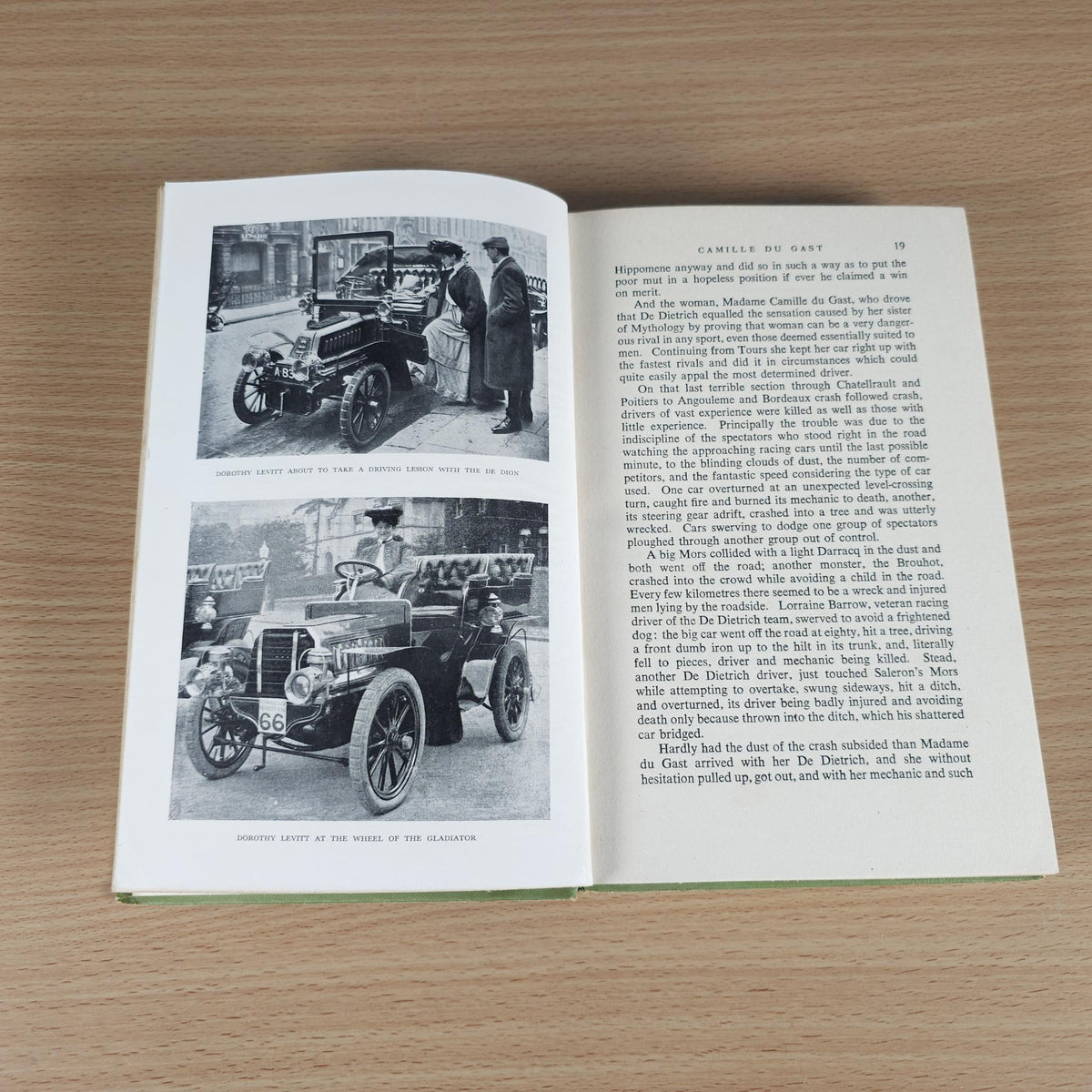Open book spread with black-and-white photos of vintage race cars.