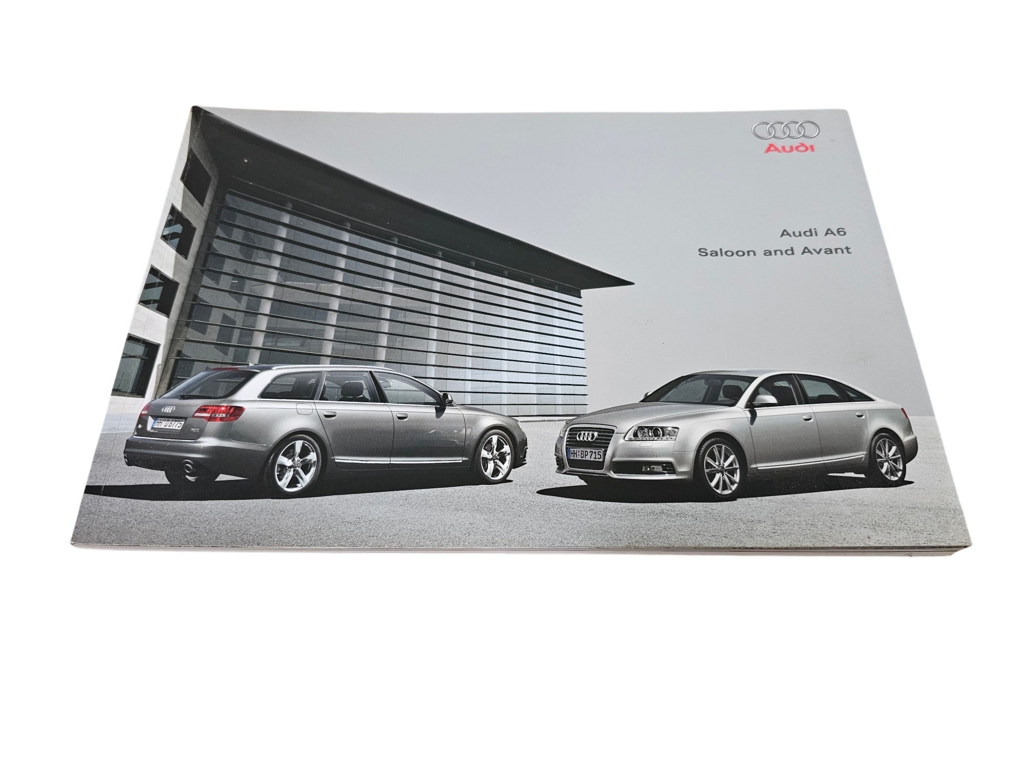 Audi A6 sales brochure with two car photos on the cover, angled view