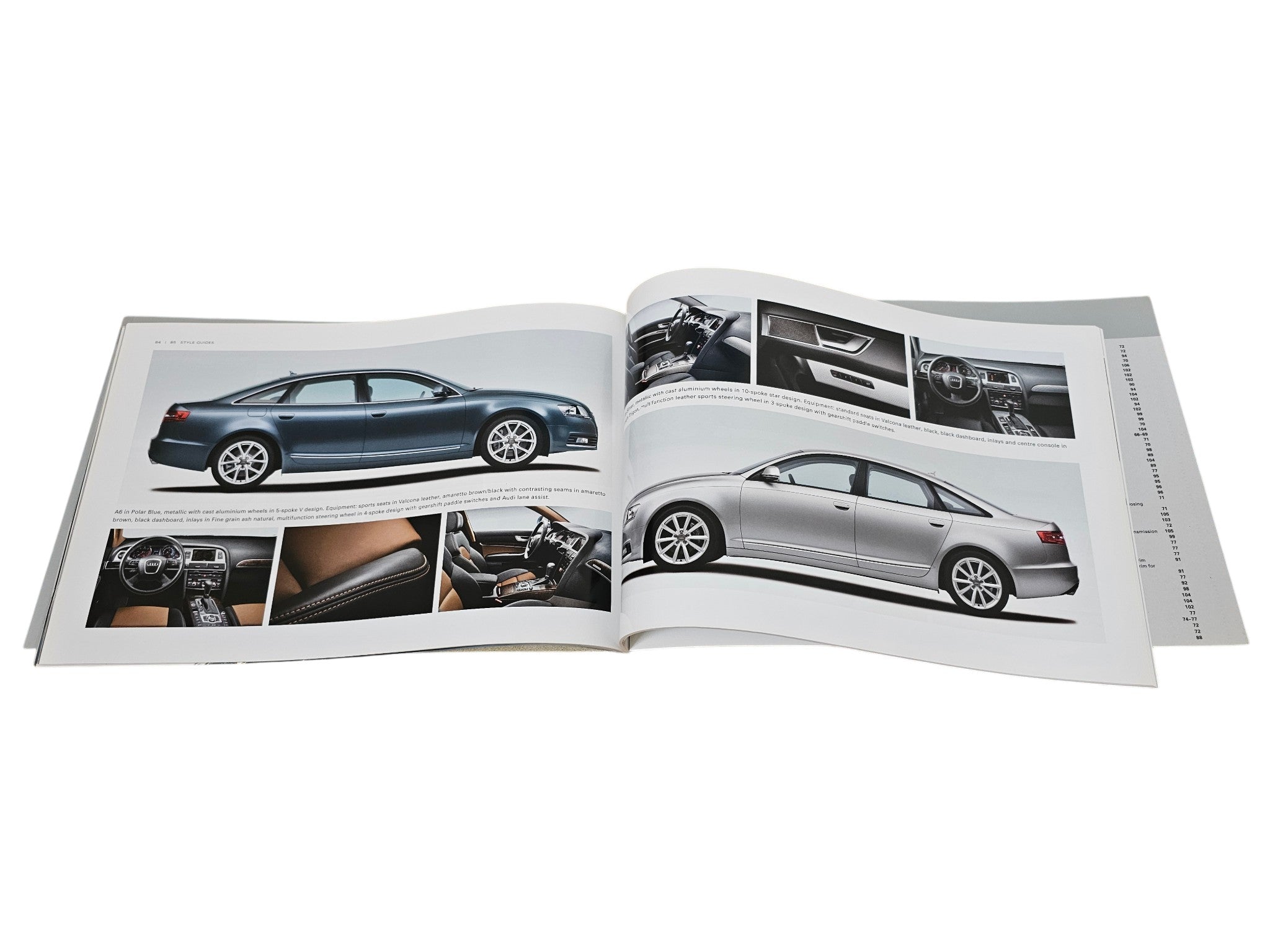 Opened brochure pages with exterior and interior vehicle photo layouts