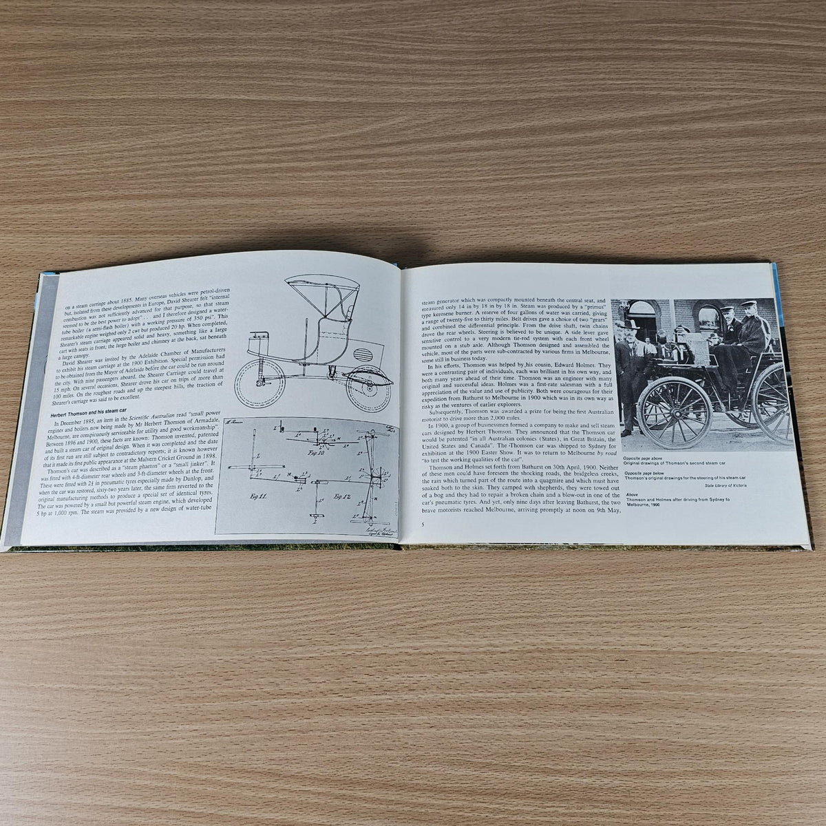 Hardcover automotive history book, open pages with vintage car diagrams and photos.