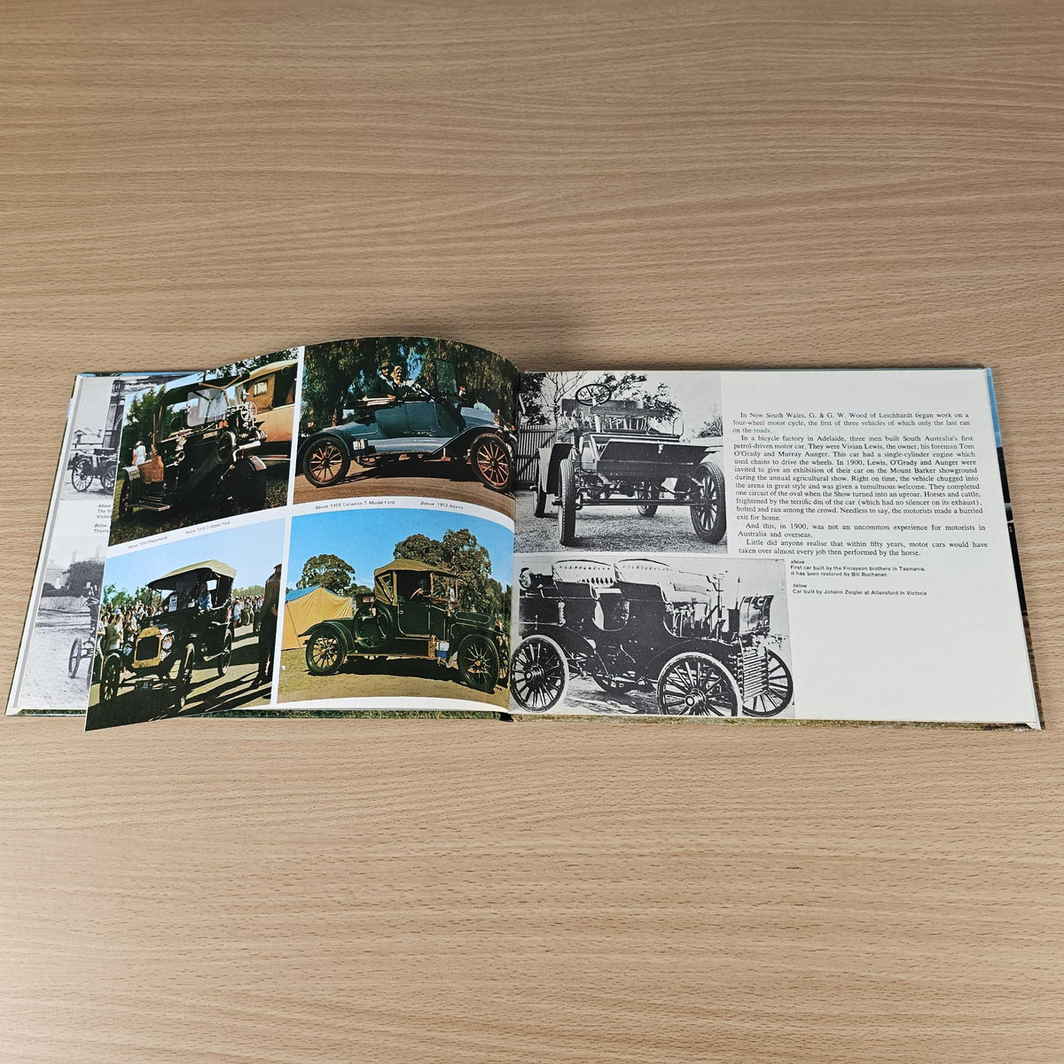 Hardcover automotive history book, open spread with collage of vintage car photos.