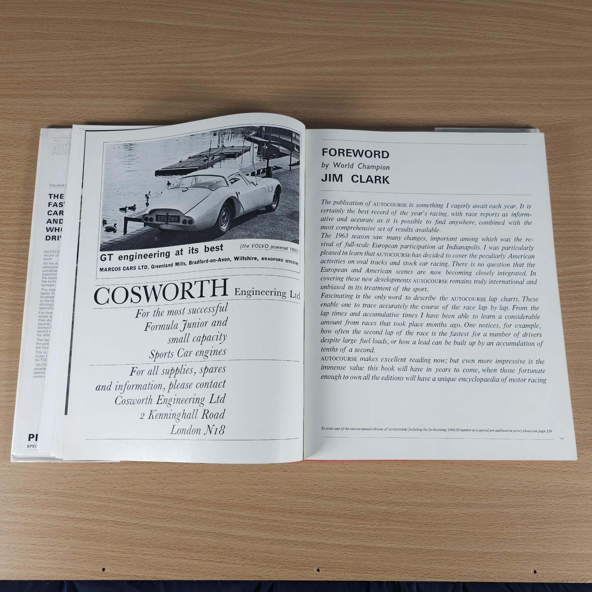 Opened motorsport book spread featuring “COSWORTH” title and “FOREWORD” text.