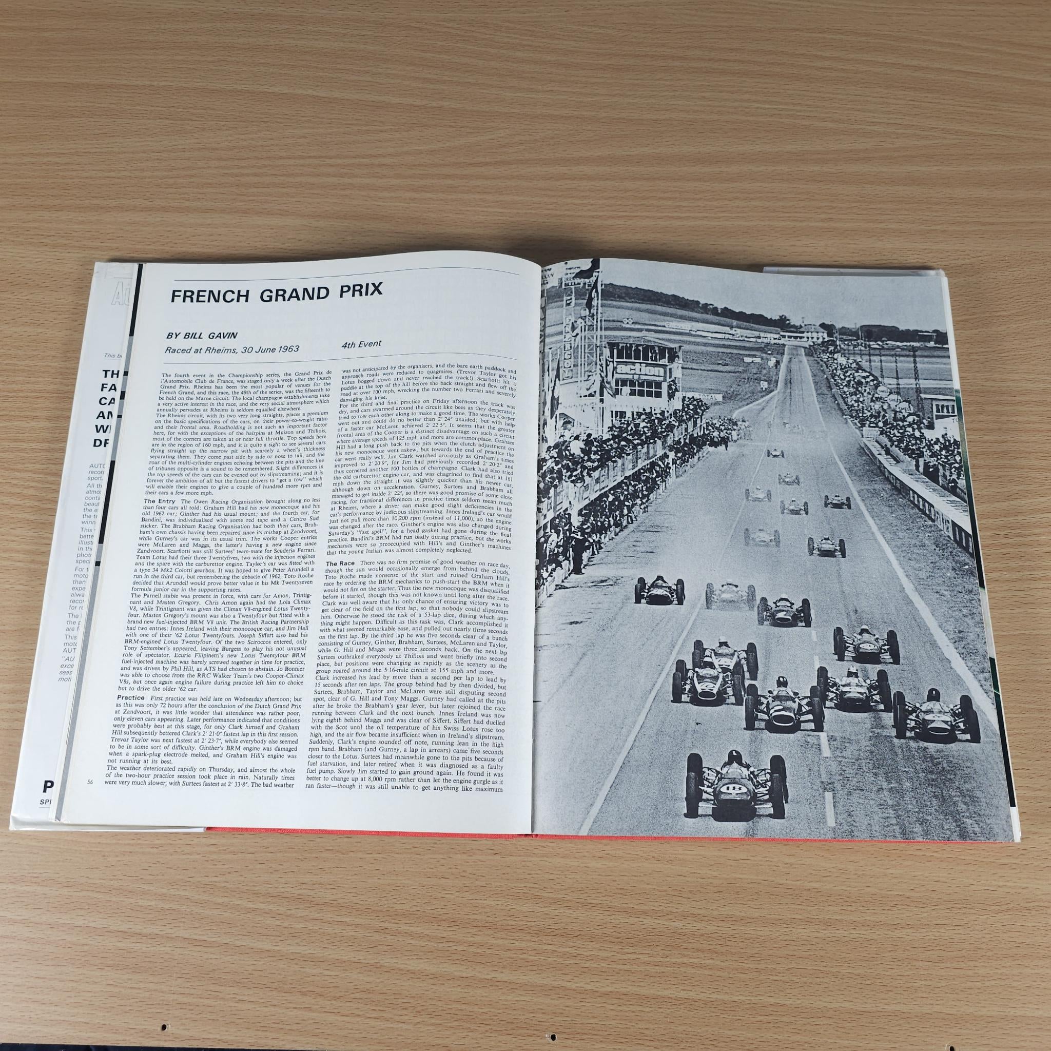 Opened motorsport book with “FRENCH GRAND PRIX” article and track photo.