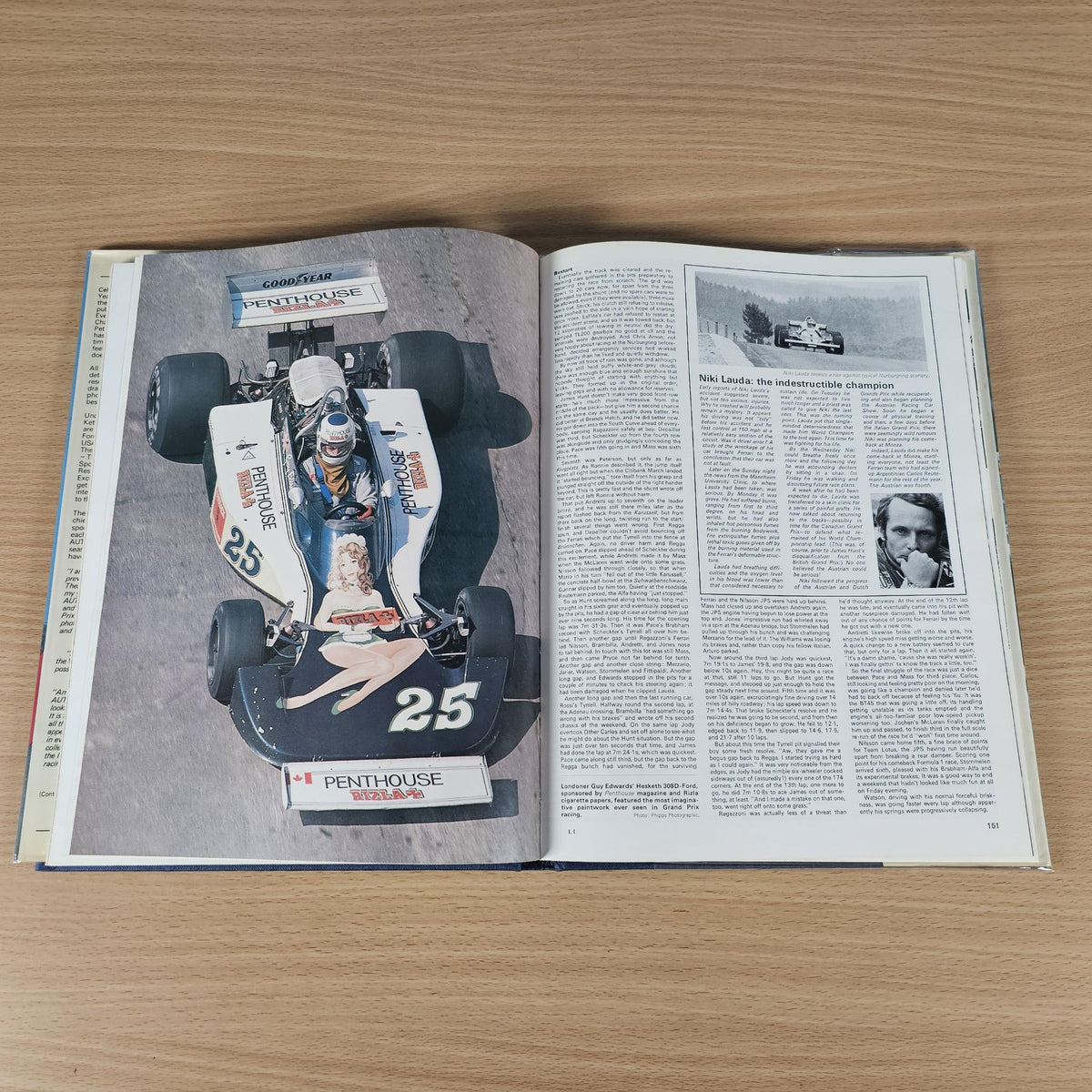 Hardcover motorsport annual, open to page with race car image and article text