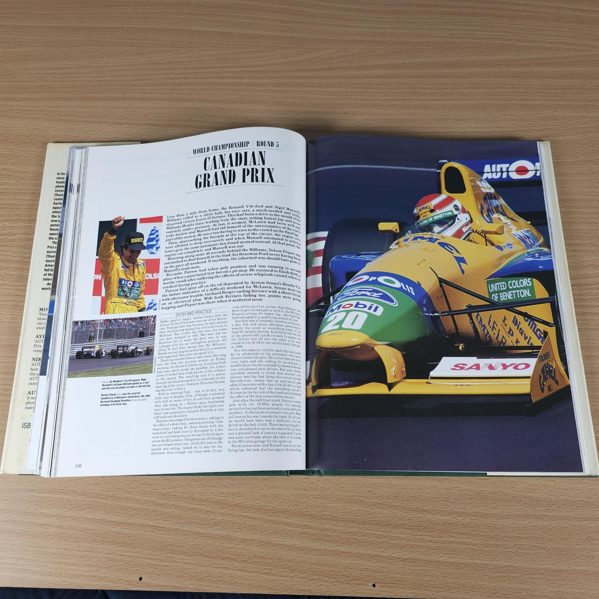 Open racing annual book with full-color race photo spread on two pages