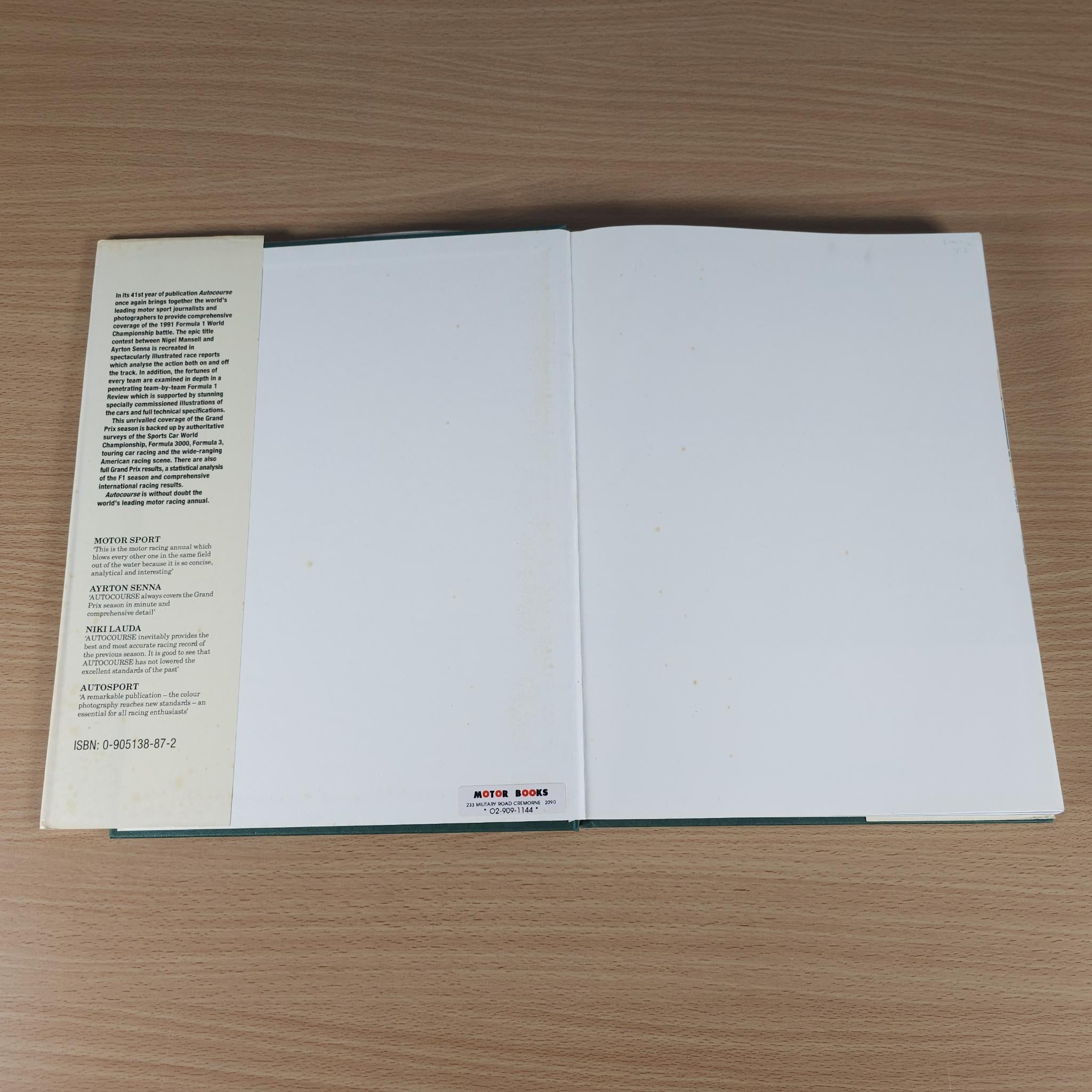 Autocourse 1991-92 hardcover book open flat to blank white interior pages