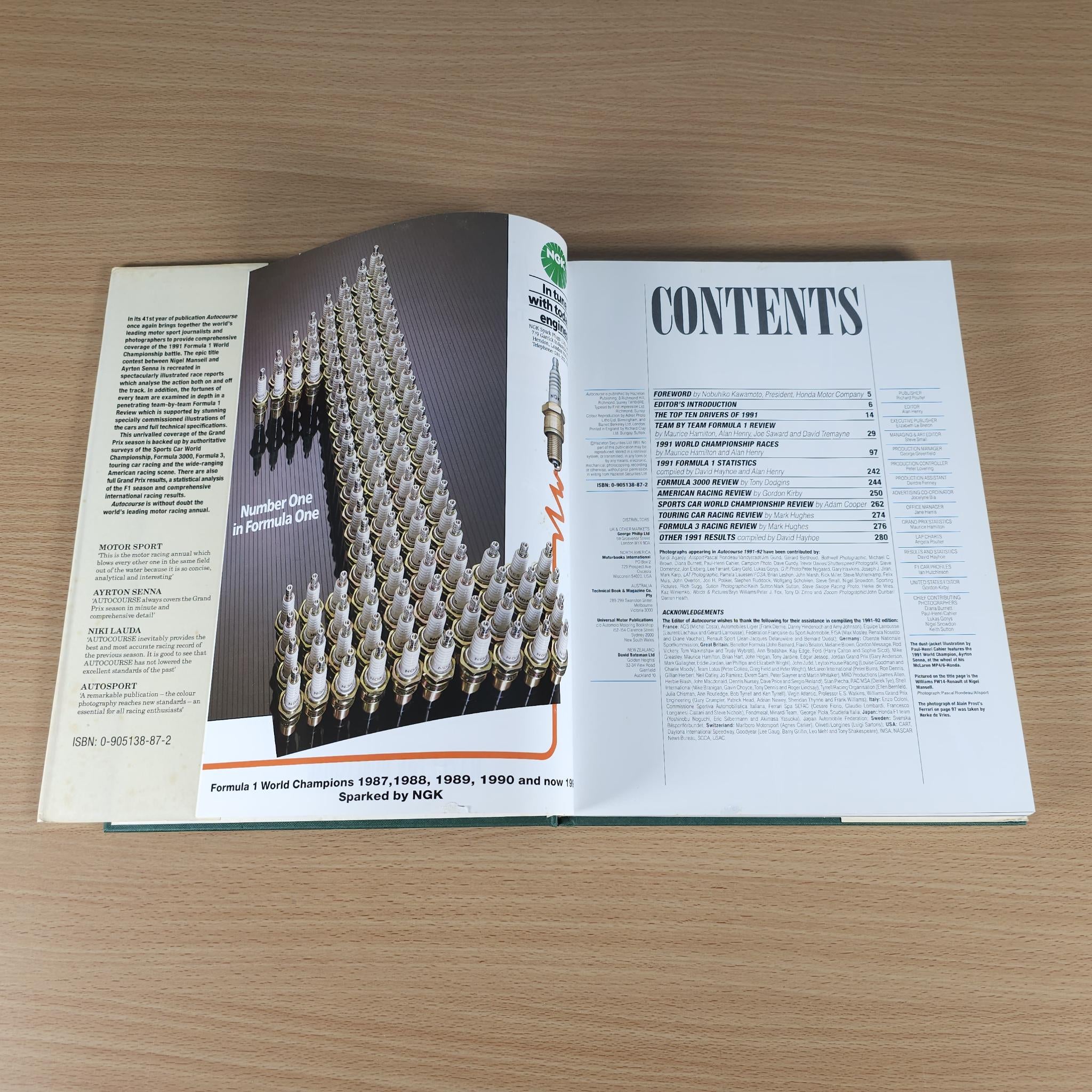 Autocourse 1991-92 book open to contents list and racing photo spread