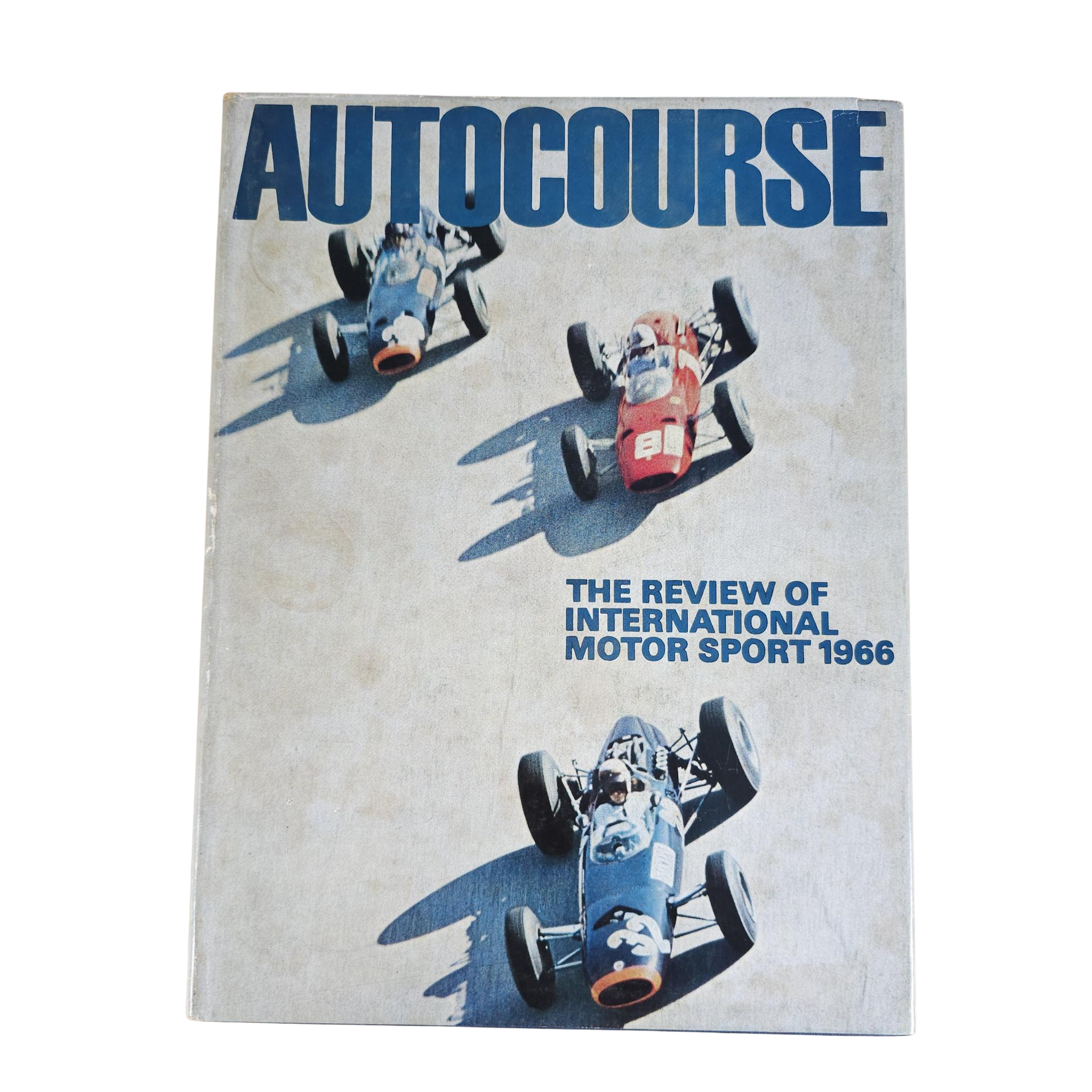 Autocourse motorsport review book cover with three race cars and blue title text