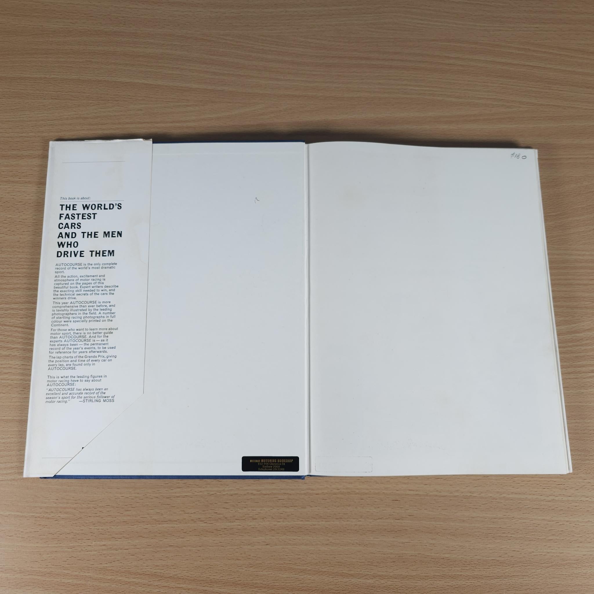 Open vintage motorsport review book with text columns on white pages