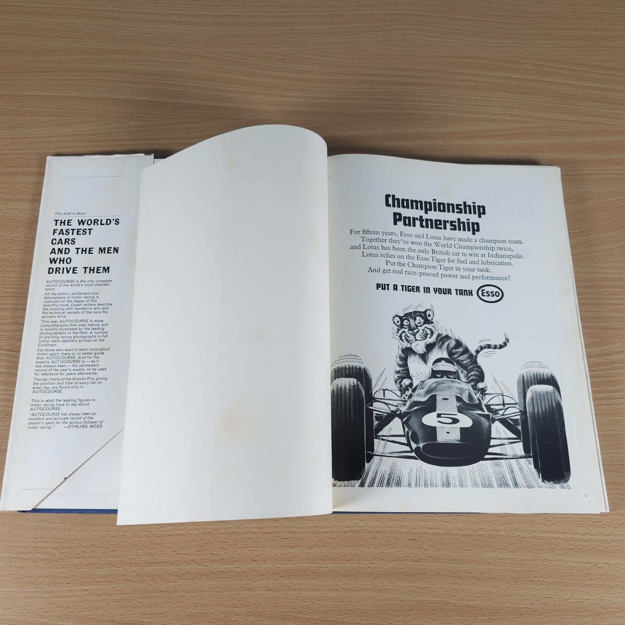 Open vintage motorsport review book spread with article text and car illustration