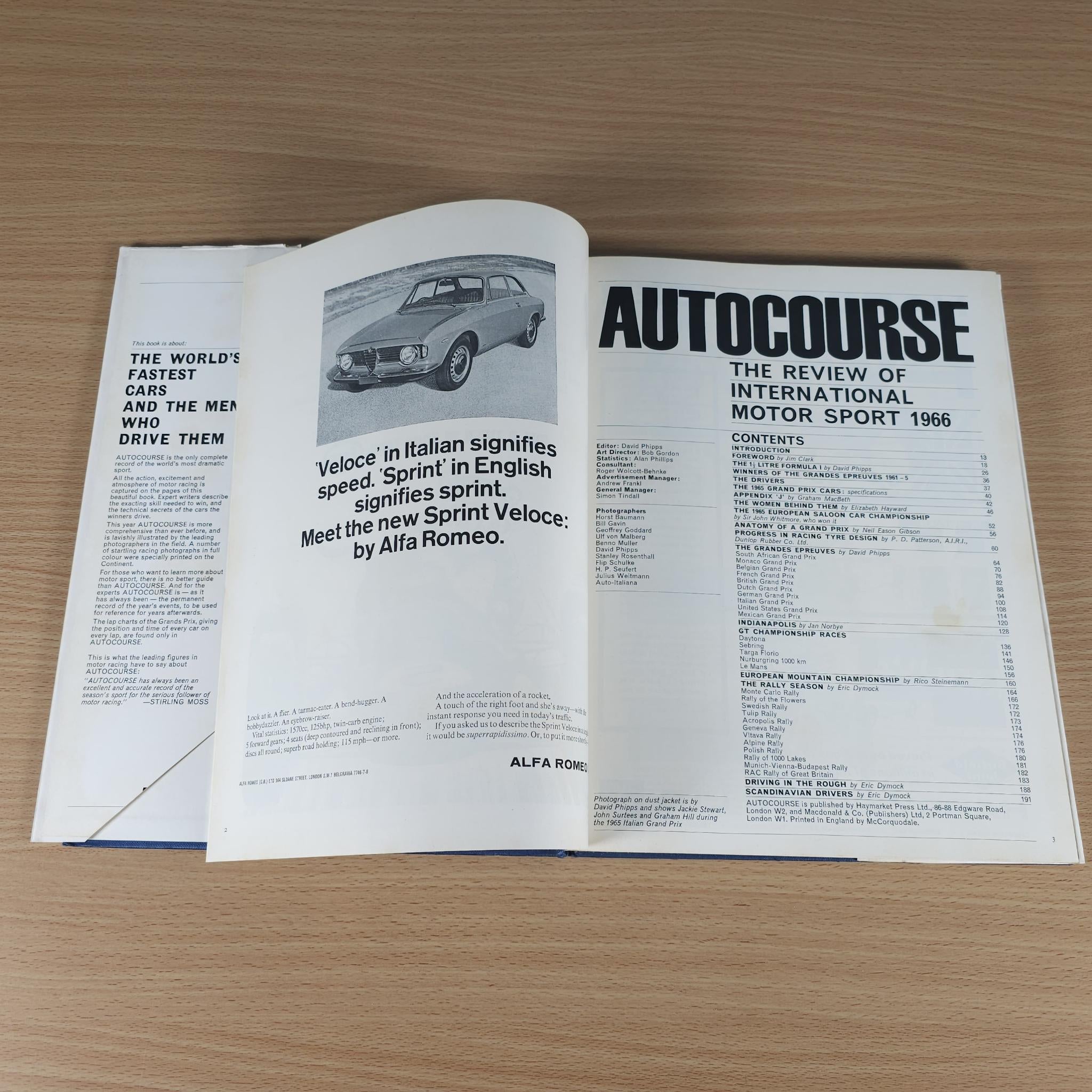 Open vintage motorsport review book with car photo, headings, and multiple text blocks