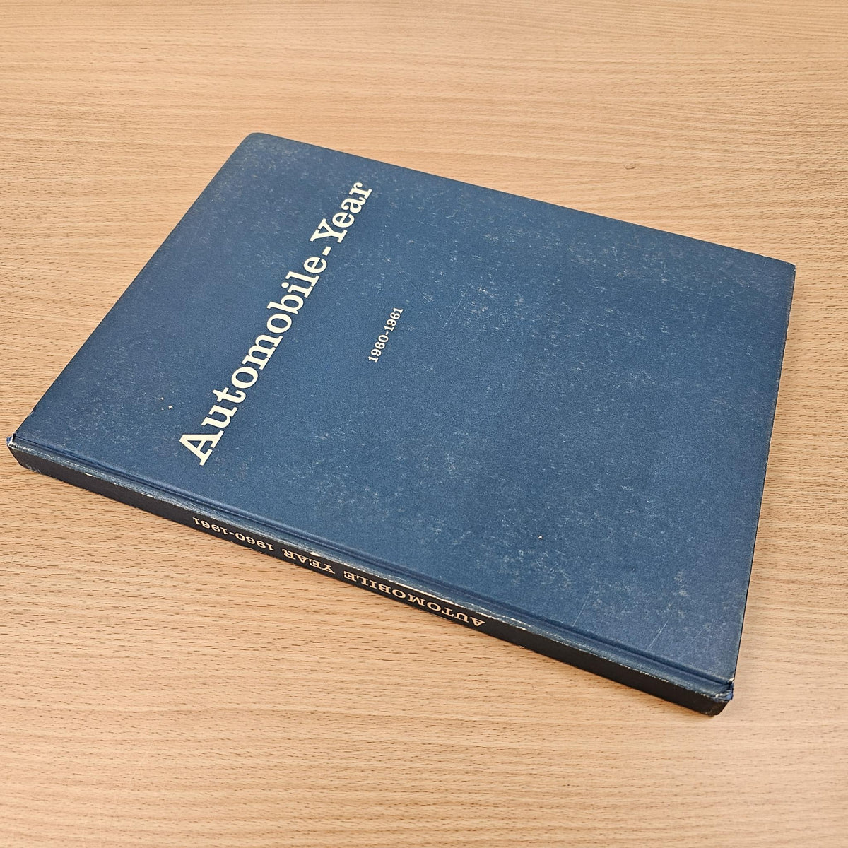 Automobile year reference book, blue cover at an angle with spine and “1960–1961” text.