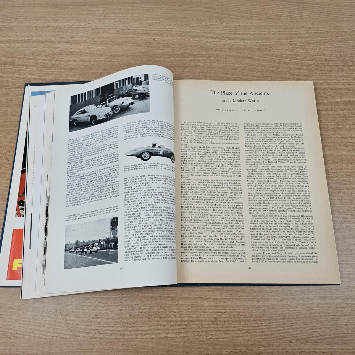 Open automobile year reference book pages with “The Place of the Ancients” article text.