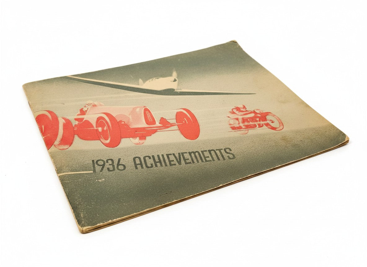 Vintage booklet cover with red racing car, '1936 Achievements' title