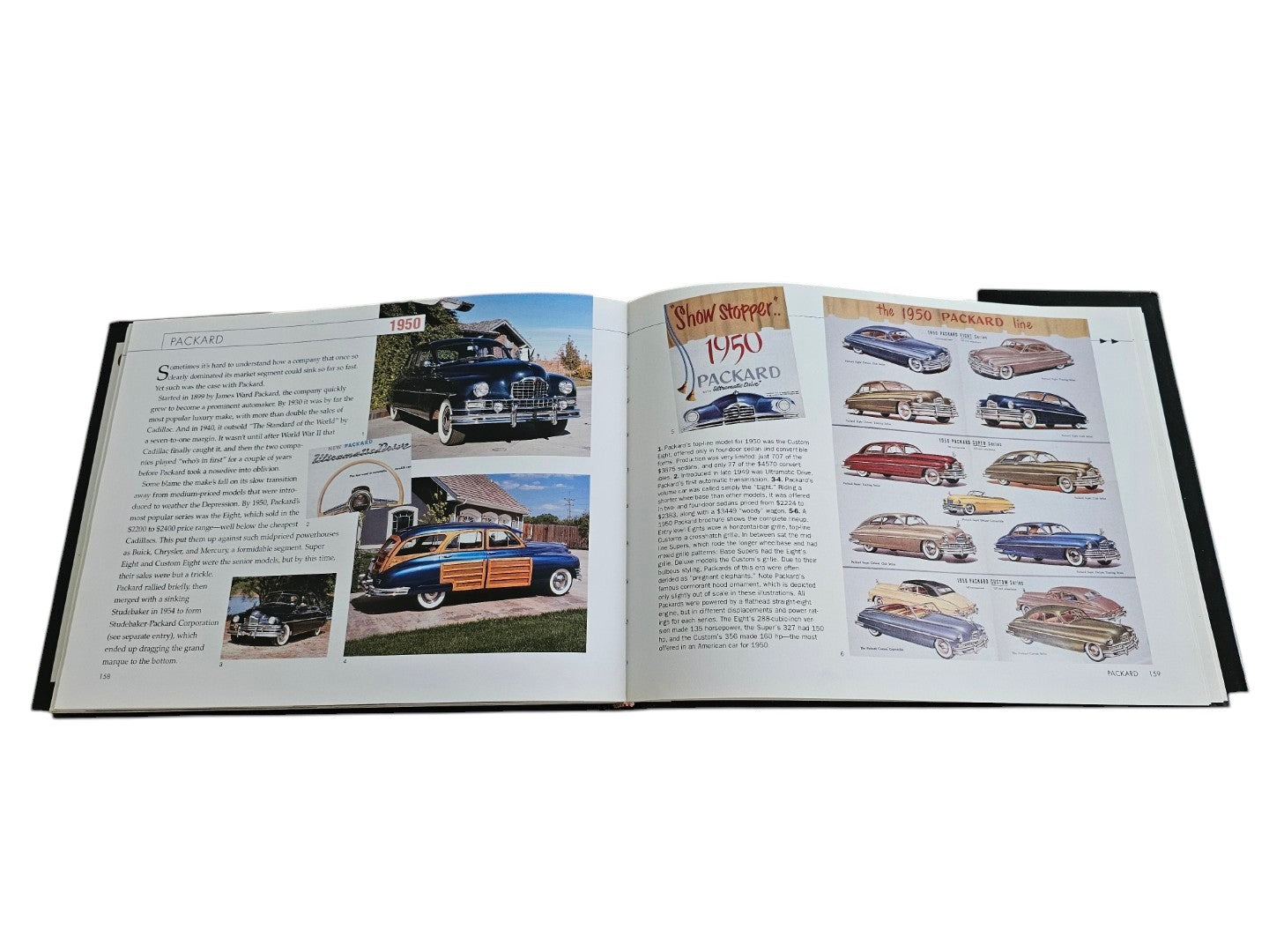 Automoto Bookshop hardcover book open to a page showing 1950 Packard car history with vintage photos and illustrations