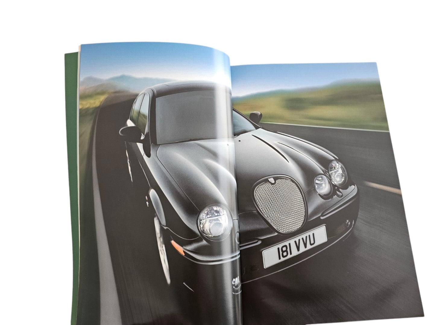Automoto Bookshop 2002 Jaguar S-Type sales brochure featuring a black sedan driving on a scenic road