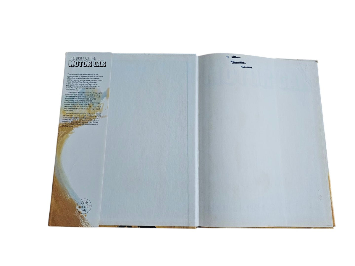 Open book spread with mostly blank white pages and small left margin text.